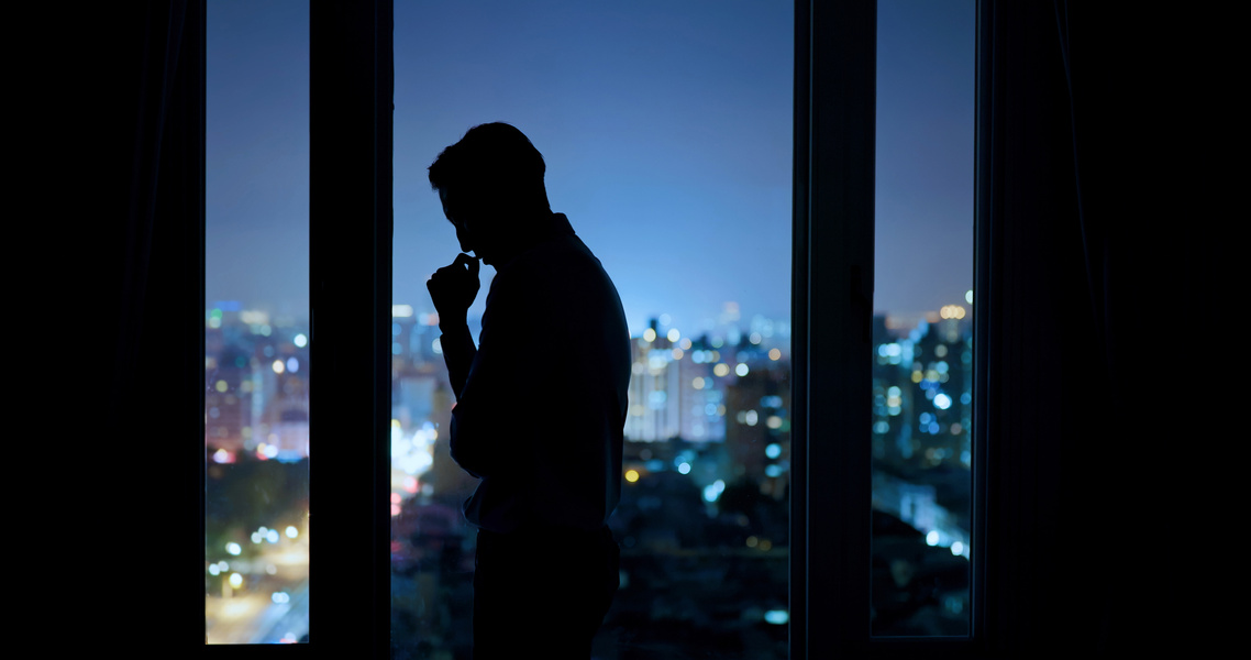 Silhouette of a Worried Businessman in the Office